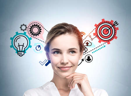 Businesswoman wearing white shirt is pondering about successful startup idea. Sketch with icons of...