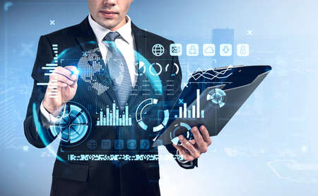 Businessman with pen point at virtual screen with stock market changes, business bar chart. Double...