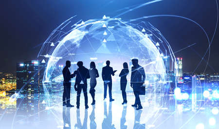 Group of business people having a conference to discuss company strategy. Silhouettes of men and...