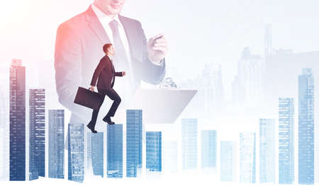 Businessman wearing formal suit is walking over the city skyscraper, his colleague is making notes...