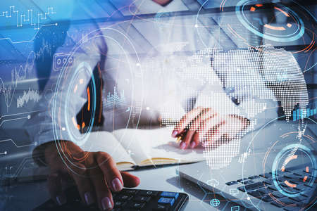 Office woman hands using calculator, office table. Double exposure with earth globe, map with stock...