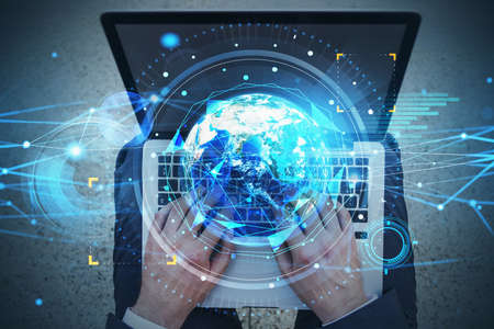 Top view shot of businessman working on laptop. Fintech industry at international business. Planet...