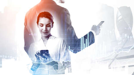 Businessman and businesswoman with smartphones, stock market changes with graphs and candlesticks,...