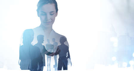 Office woman and silhouettes of diverse business people working together, blurred background of...