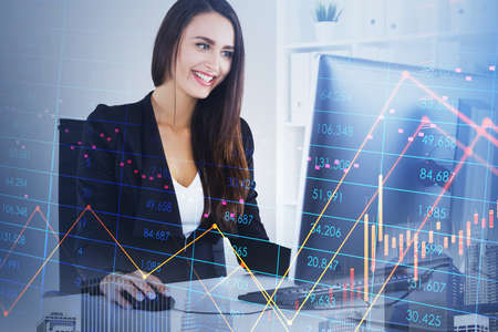 Office woman secretary with computer on the table, stock market changes and business candlesticks....