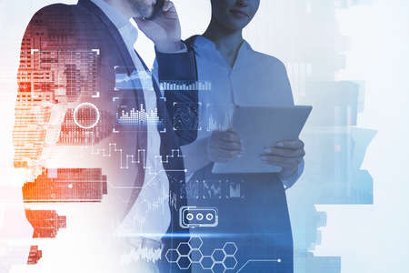 Office people with tablet, candlesticks and graph changes with hologram icons, double exposure with skyscrapers. Concept of finance, technology and teamworkの写真素材