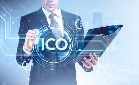 Businessman using his planner checking the ICO agenda of upcoming cryptocurrency meet up. Financial...