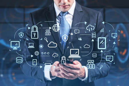 Businessman in suit using smartphone, double exposure with network circuit icons. Global communication concept of technology and cyber securityの写真素材