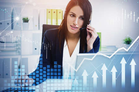 Attractive brunette businesswoman or stock trader analyzing stock graph forecast, business woman...