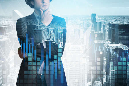Handsome trader in suit in crossed arms pose dreaming about positive behavior of stock market....