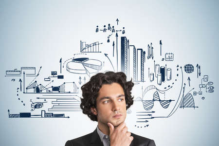 Office man thinking, pensive look. Business strategy plan on blue background, doodle drawing with graph changes and dynamics. Concept of financial analysis and stock marketの写真素材