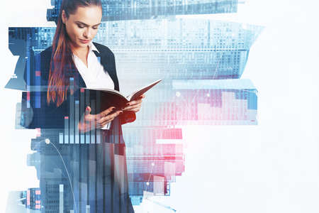 Office woman studying files in hands, pensive look, buildings and stock market graph changes with lines double exposure. Concept of trader and financial advisorの写真素材