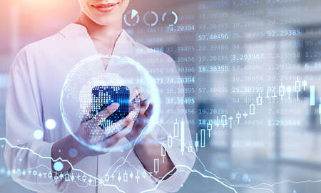 Office woman using phone, smiling. Blue hologram of digital interface, candlesticks and earth...