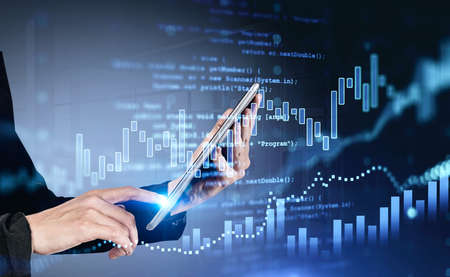 Office woman finger touch digital tablet in hands. Stock market changes, forex dynamics, numbers and...