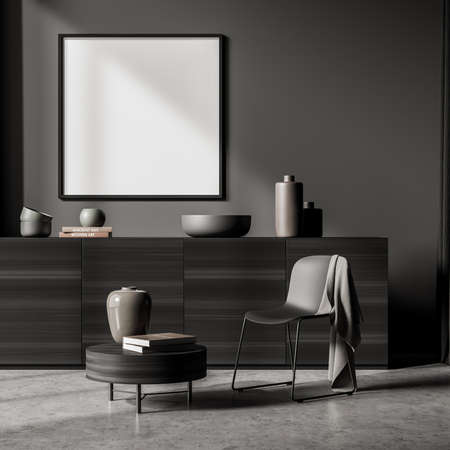 Relaxing room interior with gray commode and a black chair, coffee table with books on gray concrete...