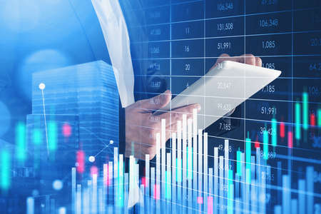 Office man typing on tablet screen, digital interface with stock market changes. Double exposure...