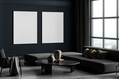 Two framed mockup posters in villa living room design interior, gray furniture on blue wall, cement floor. Concept of relax. Panoramic window. 3d renderingの写真素材