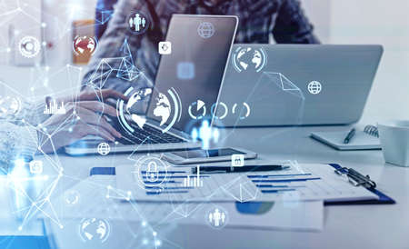 Business people with laptops working on protection of cyber security network, blue glowing...