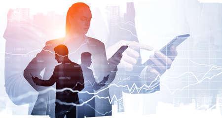 Businesswoman and businessman using smartphones in hands. Stock market chart with lines changes....