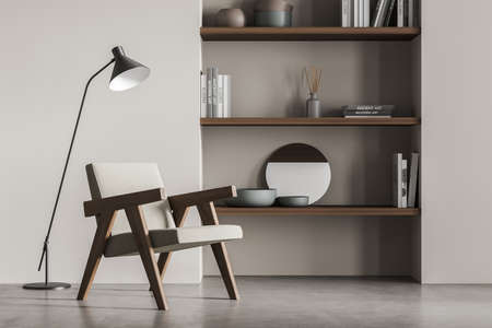 Light reading room interior with one armchair and lamp, rack with books and decoration. Minimalist relaxing space on concrete floor. 3D renderingの写真素材