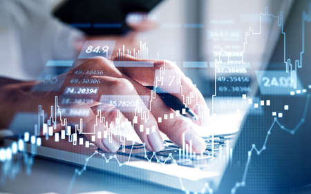 Businesswoman trader hands working with laptop. Stock market changes, business candlesticks graph...