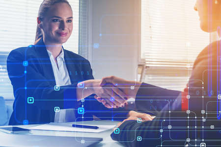 Businesswoman and businessman handshake. Work together on project to protect a cyber security from...