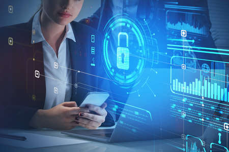 Businesswoman with smartphone, blue hologram glowing digital information security interface. Concept...