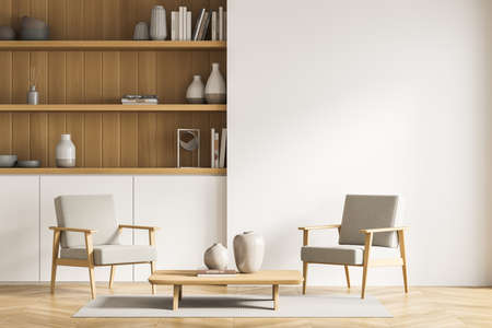 Two armchairs with coffee table near the built-in cabinet, having three open wooden shelves. Rug on...