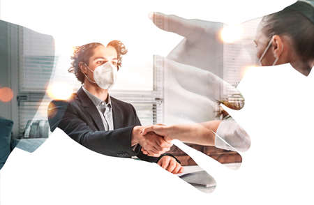 Double exposure of handshake of two business people in formal wear, recruitment process. Face...
