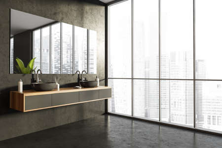 Corner of bathroom with panoramic view, mirror, sinks, shelf with wood alike details, dark stone floor and wall. Minimalist interior. Concept of a modern house design. 3d renderingの写真素材