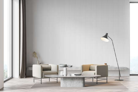 Living room interior with two comfortable beige armchair, carpet, oak wooden parquet floor and...