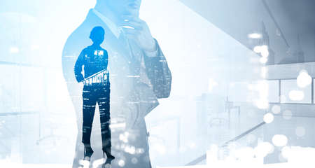 Silhouette of businesswoman and serious businessman wearing formal suit. Office and financial city...