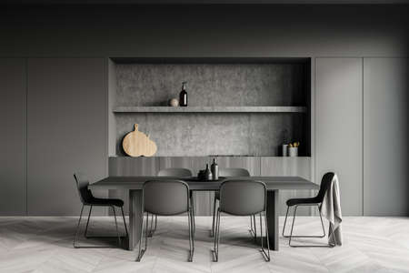 Dark cozy kitchen room interior with dining table, six chairs, parquet floor, electric cooker and...