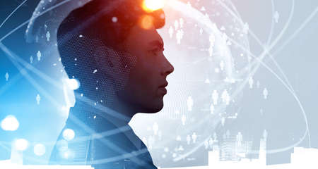 Businessman wearing formal suit is looking at hologram of the globe with icons of people. Financial...