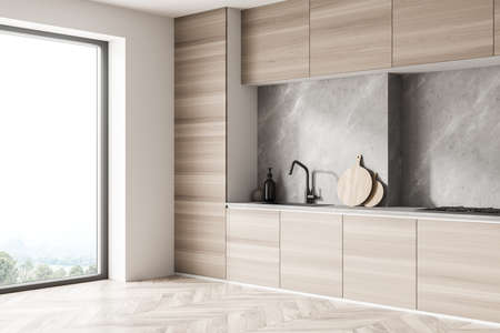 Corner view on cozy kitchen room interior with electric cooker, oak wooden parquet floor and panoramic window. Contemporary Scandinavian minimalist design. Blank space for creative idea. 3d renderingの写真素材