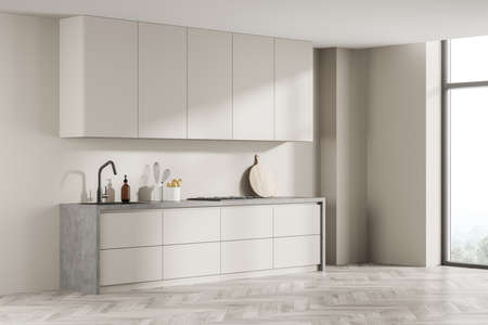 Simple design of the light beige kitchen with gray detail and white wood parquet flooring in the minimalist space of modern house interior. 3d renderingの写真素材