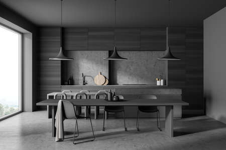 Dark kitchen room interior with dining table, twelve chairs, concrete floor, electric cooker and...