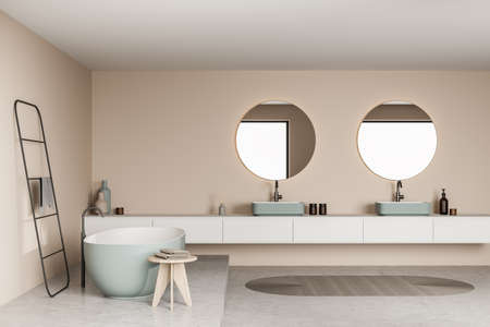 Bathroom interior with beige walls and green ceramics, having a minimalist bathtub area and a trendy...