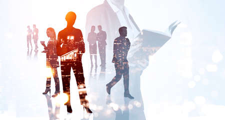Silhouettes of group of business people work together discussing and talking about future of...