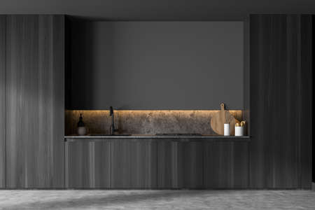 Wooden kitchen with stylish cabinets and original niche design, using a marble splashback with the worktop and an empty gray wall detail. A concept of the on trend interior. 3d renderingの写真素材