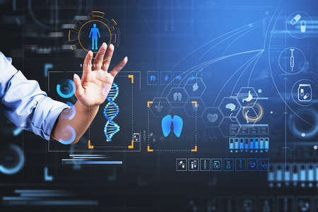 Businessman wearing blue shirt is touching digital interface with icons of dna, tooth, lungs, heart, brain, stomach, bones, bacteria, pills in foreground. Concept of heath care and diagnosticsの写真素材