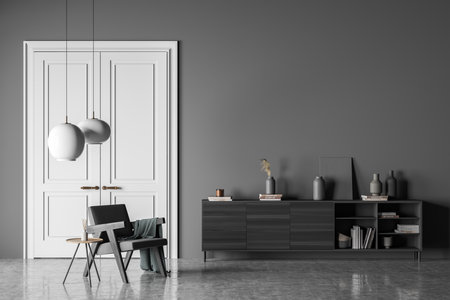 Dark living room interior with empty wall, armchair, doors, coffee table, sideboard and concrete floor. Concept of minimalist design for chill and relaxation. 3d renderingの写真素材