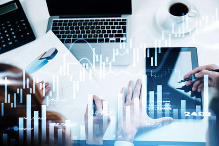 Businessman and businesswoman wearing white shirt are working together. Office workplace with laptop...