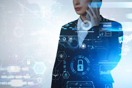 Businesswoman wearing formal suit is talking on smartphone. Digital interface with hud with padlock,...