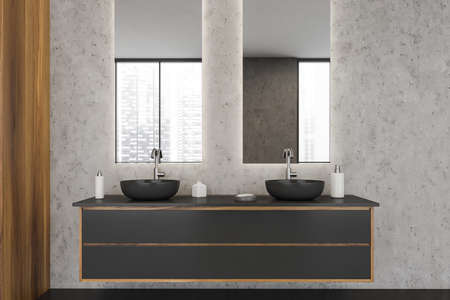Bathroom interior with light gray marble walls, two vertical mirrors and a dark gray vanity with wood details and two floating sinks. A concept of modern apartment design. 3d renderingの写真素材