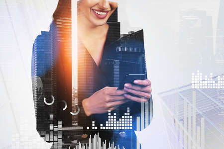 Smiling businesswoman holds smartphone, white hologram glowing digital information interface....