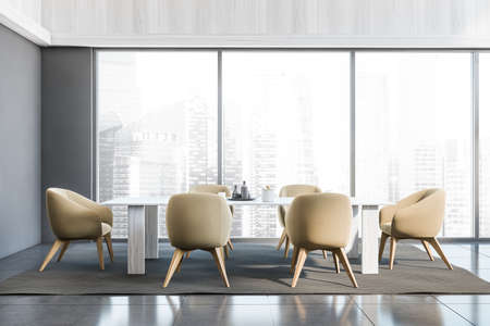 Panoramic gray dining room interior with white wood materials, six beige chairs, a table and a rug on the tiled floor. A concept of modern apartment and hotel design. 3d renderingの写真素材