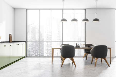 Modern kitchen interior with dining table, four grey chairs, ceiling lamp, green cabinets and...