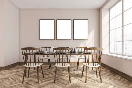 Light eating room interior with wooden chairs on parquet floor. Minimalist dining room with furniture near window with city view. Row of three blank frames, 3D renderingの写真素材
