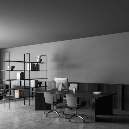 Corner view on dark office room interior with desktop, comfortable armchair, desk, books, bookshelf,...